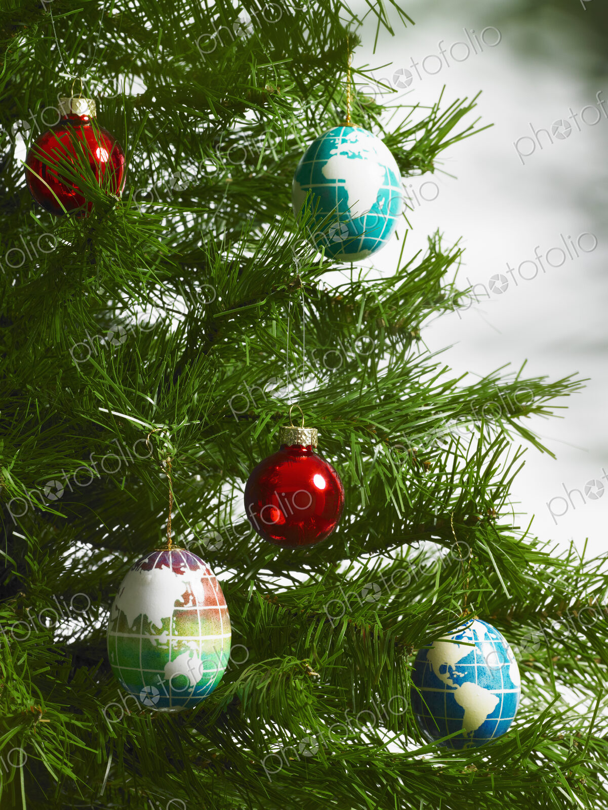 Christmas decorations, small group of red and blue tree ornaments on a tree