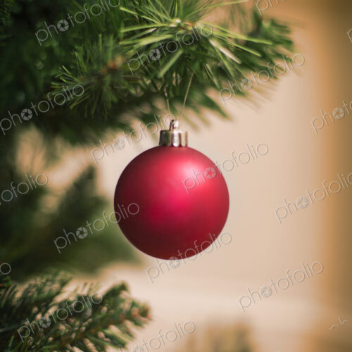 Christmas decorations. A traditional real Christmas tree, decorated with a red bauble. Christmas decorations. A traditional real Christmas tree, decorated with a red bauble.
