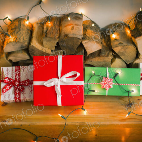 Christmas decorations. Gift boxes tied with a ribbon and fairy lights. Christmas decorations. Gift boxes tied with a ribbon and fairy lights.