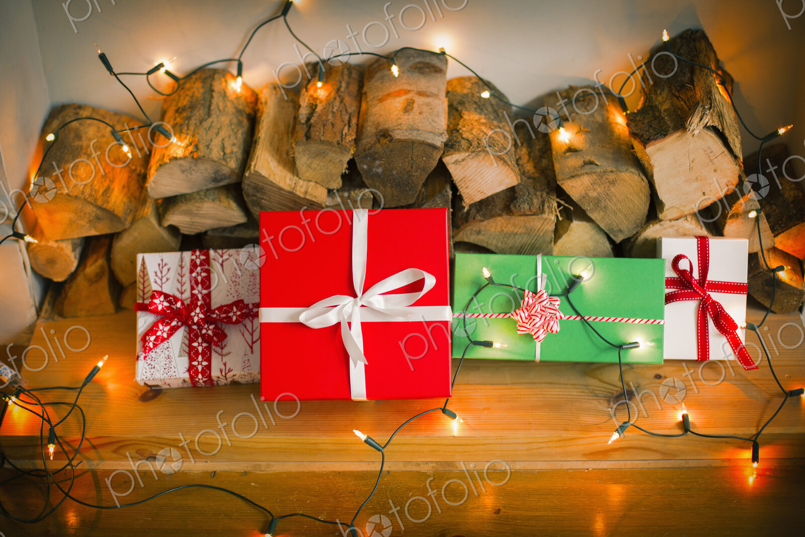 Christmas decorations. Gift boxes tied with a ribbon and fairy lights.