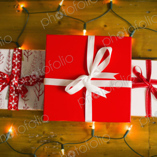 Christmas decorations. Gift boxes tied with a ribbon and fairy lights. Christmas decorations. Gift boxes tied with a ribbon and fairy lights.