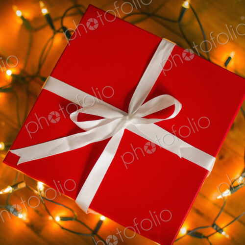 Christmas decorations. Gift boxes tied with a ribbon and fairy lights. Christmas decorations. Gift boxes tied with a ribbon and fairy lights.