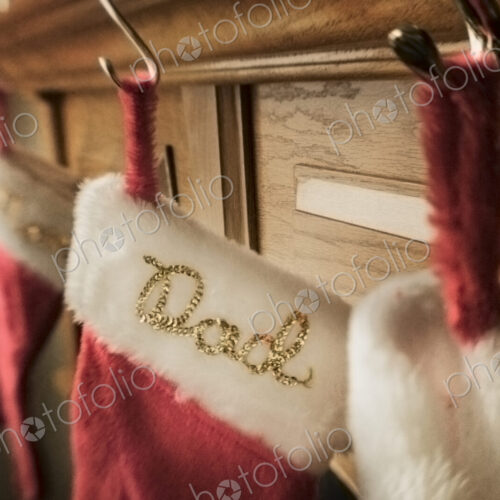 Christmas stockings hanging from a mantelpiece.