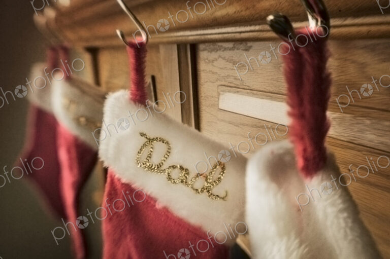 Christmas stockings hanging from a mantelpiece.