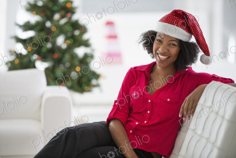 Christmas time. Celebrating the holidays. A woman wearing a red and white Father…