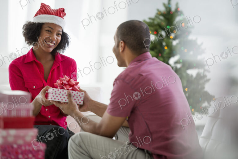 Christmas time. Celebrating the holidays. A woman wearing a red and white Father…