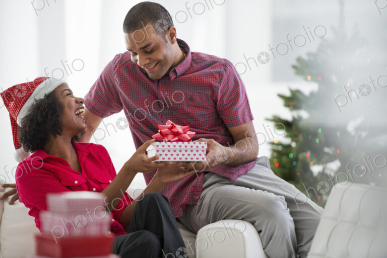 Christmas time. Celebrating the holidays. A woman wearing a red and white Father…