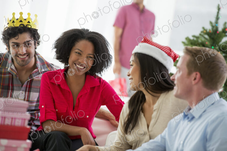 Christmas time. Celebrating the holidays. A woman wearing a red and white Father…