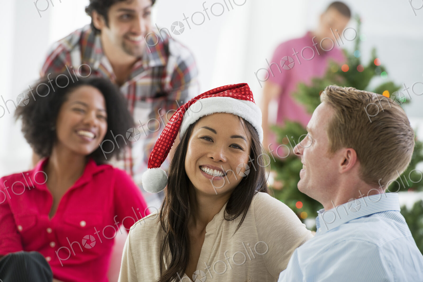 Christmas time. Celebrating the holidays. A woman wearing a red and white Father…