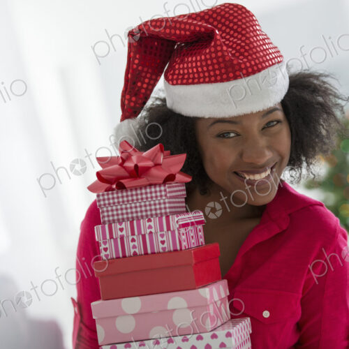 Christmas time. Celebrating the holidays. A woman wearing a red and white Father…