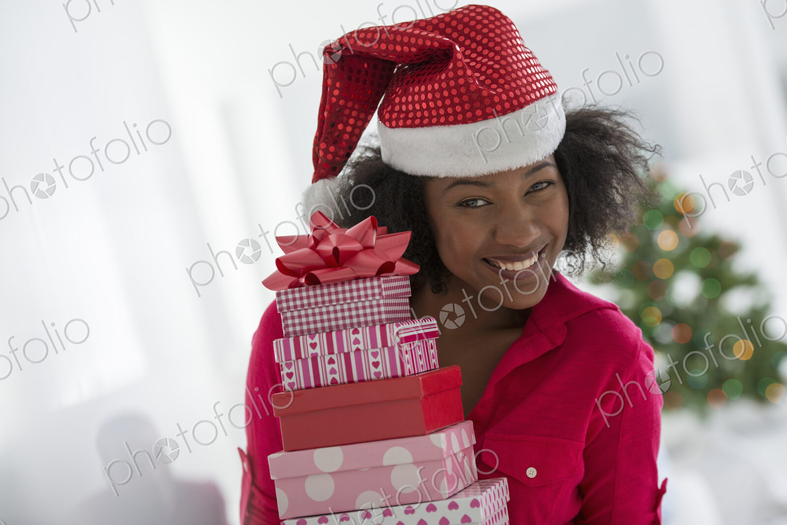 Christmas time. Celebrating the holidays. A woman wearing a red and white Father…