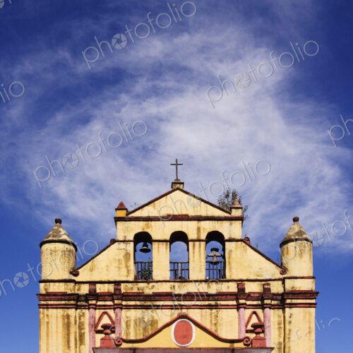 Church and bells against blue sky, Chiapas, Mexico