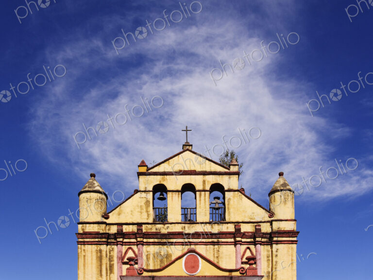 Church and bells against blue sky, Chiapas, Mexico