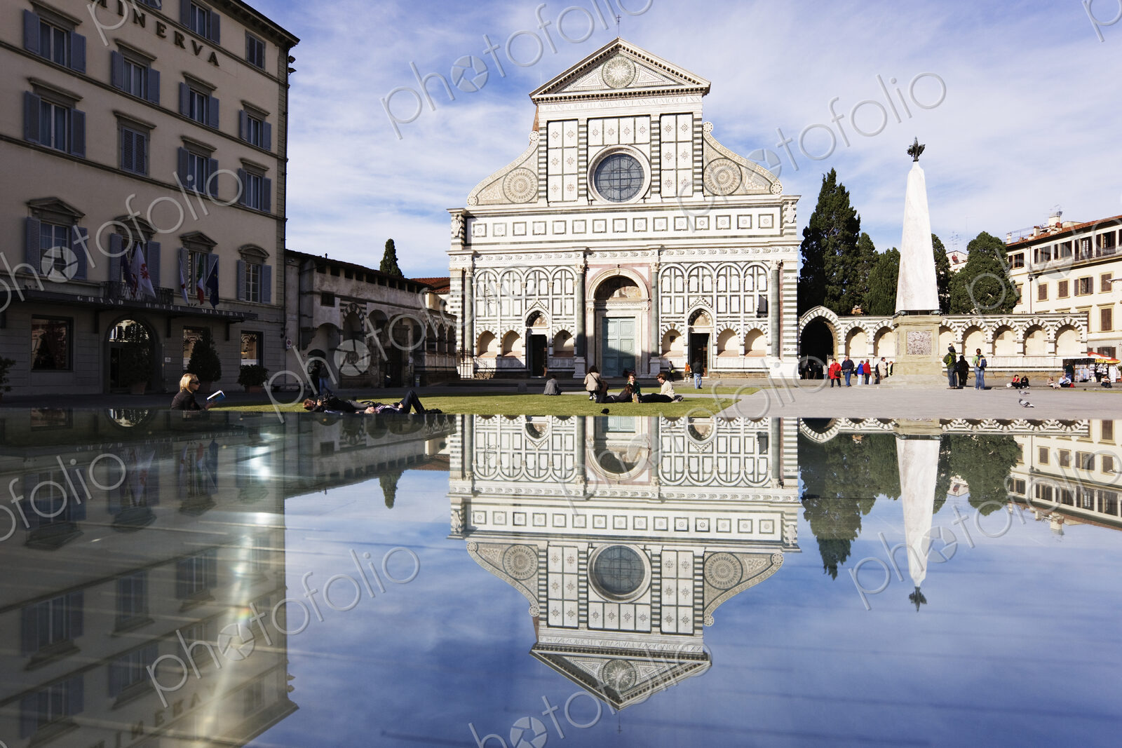 Church reflected in pond in town square.