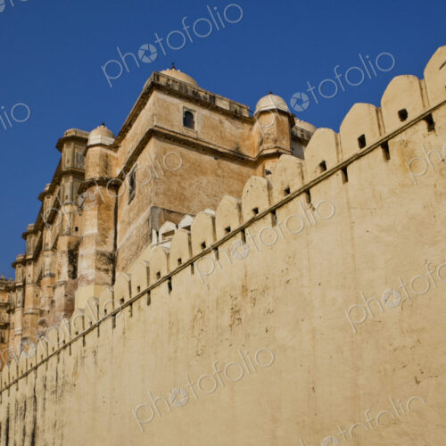 City Palace in Udaipur, Rajasthan, a high fortress wall built around an elegant palace… City Palace in Udaipur, Rajasthan, a high fortress wall built around an elegant palace…
