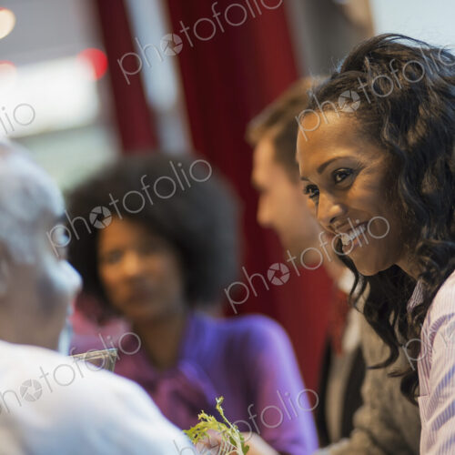 City life. A group of people in a coffee shop, talking to each other. Men and women. City life. A group of people in a coffee shop, talking to each other. Men and women.