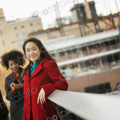 City life. A group of people on the go, keeping in contact, using mobile phones, and… City life. A group of people on the go, keeping in contact, using mobile phones, and…
