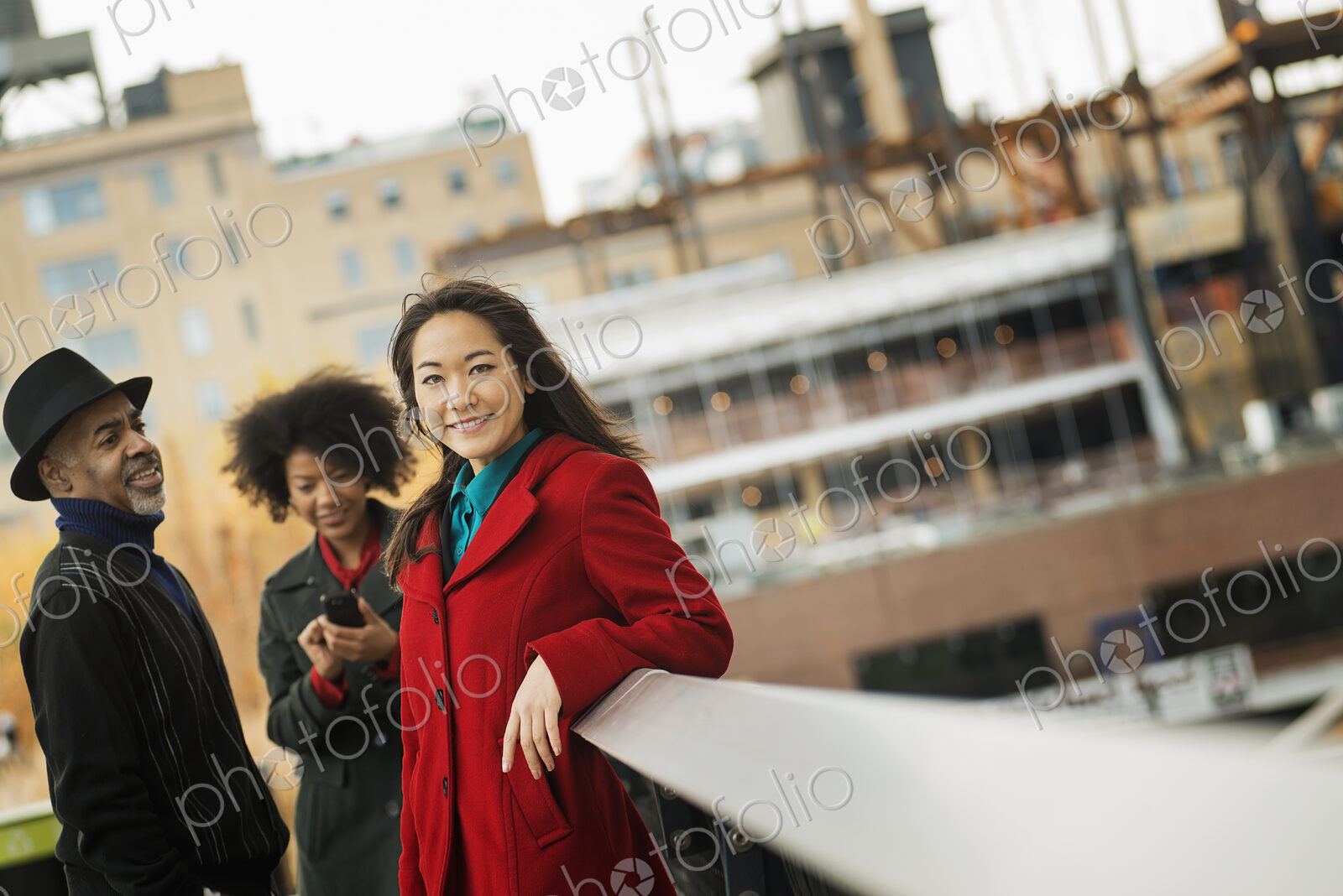 City life. A group of people on the go, keeping in contact, using mobile phones, and…