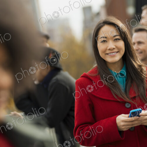 City life. A group of people on the go, keeping in contact, using mobile phones, and… City life. A group of people on the go, keeping in contact, using mobile phones, and…