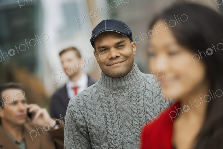 City life. A group of people on the go, keeping in contact, using mobile phones, and…