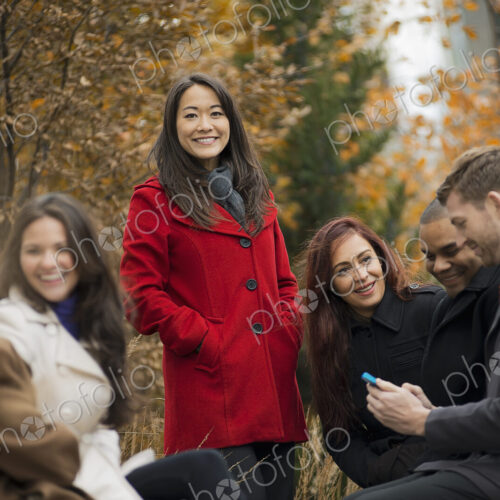 City life. A group of people on the go, keeping in contact, using mobile phones, and… City life. A group of people on the go, keeping in contact, using mobile phones, and…