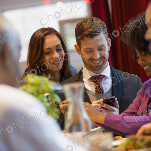 City life. A group of people on the go, keeping in contact, using mobile phones, and… City life. A group of people on the go, keeping in contact, using mobile phones, and…