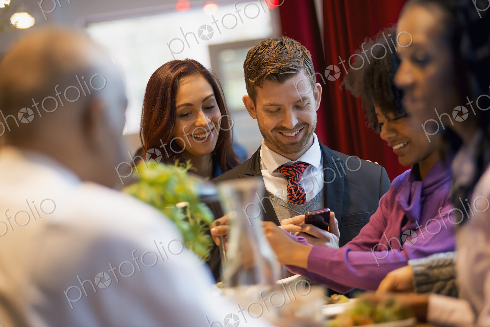City life. A group of people on the go, keeping in contact, using mobile phones, and…