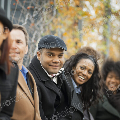 City life. A group of people on the go, keeping in contact, using mobile phones. Men… City life. A group of people on the go, keeping in contact, using mobile phones. Men…