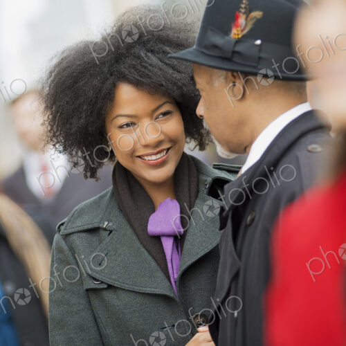 City life. A group of people on the go,on the street. A man and woman standing close… City life. A group of people on the go,on the street. A man and woman standing close…