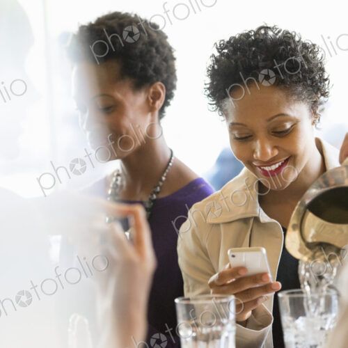City life. A group of people sitting in a cafe or bar around a table. Men and women… City life. A group of people sitting in a cafe or bar around a table. Men and women…