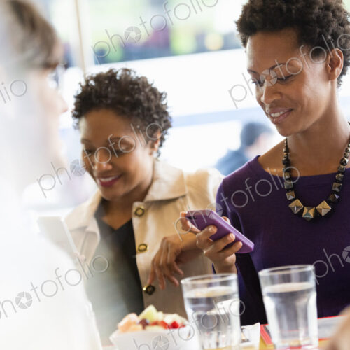 City life. A group of people sitting in a cafe or bar around a table. Men and women… City life. A group of people sitting in a cafe or bar around a table. Men and women…