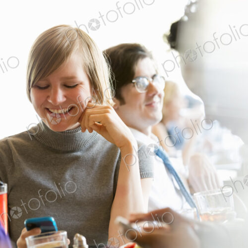 City life. A group of people sitting in a cafe or bar around a table. Men and women… City life. A group of people sitting in a cafe or bar around a table. Men and women…