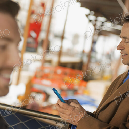 City life. Professionals on the go, keeping in contact, using mobile phones, and… City life. Professionals on the go, keeping in contact, using mobile phones, and…