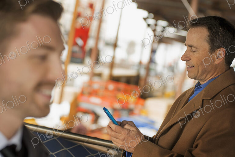 City life. Professionals on the go, keeping in contact, using mobile phones, and…