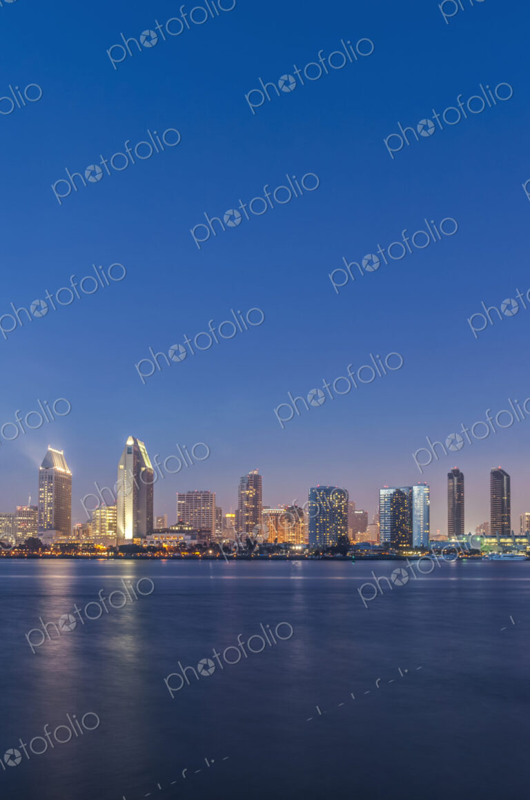 City skyline lit up at night, San Diego, California, United States