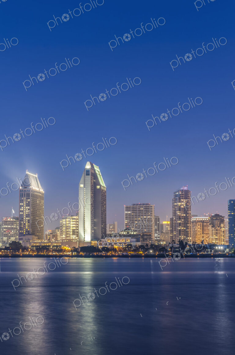 City skyline lit up at night, San Diego, California, United States