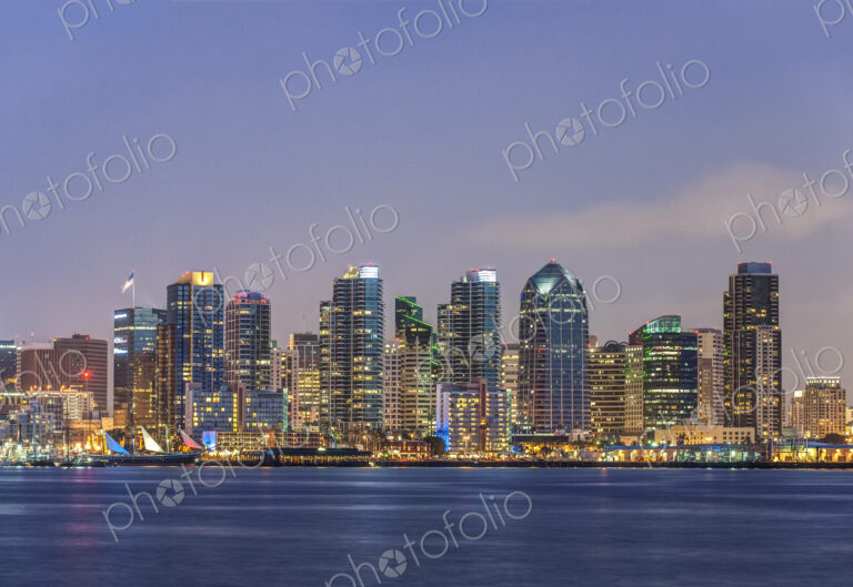 City skyline lit up at night, San Diego, California, United States