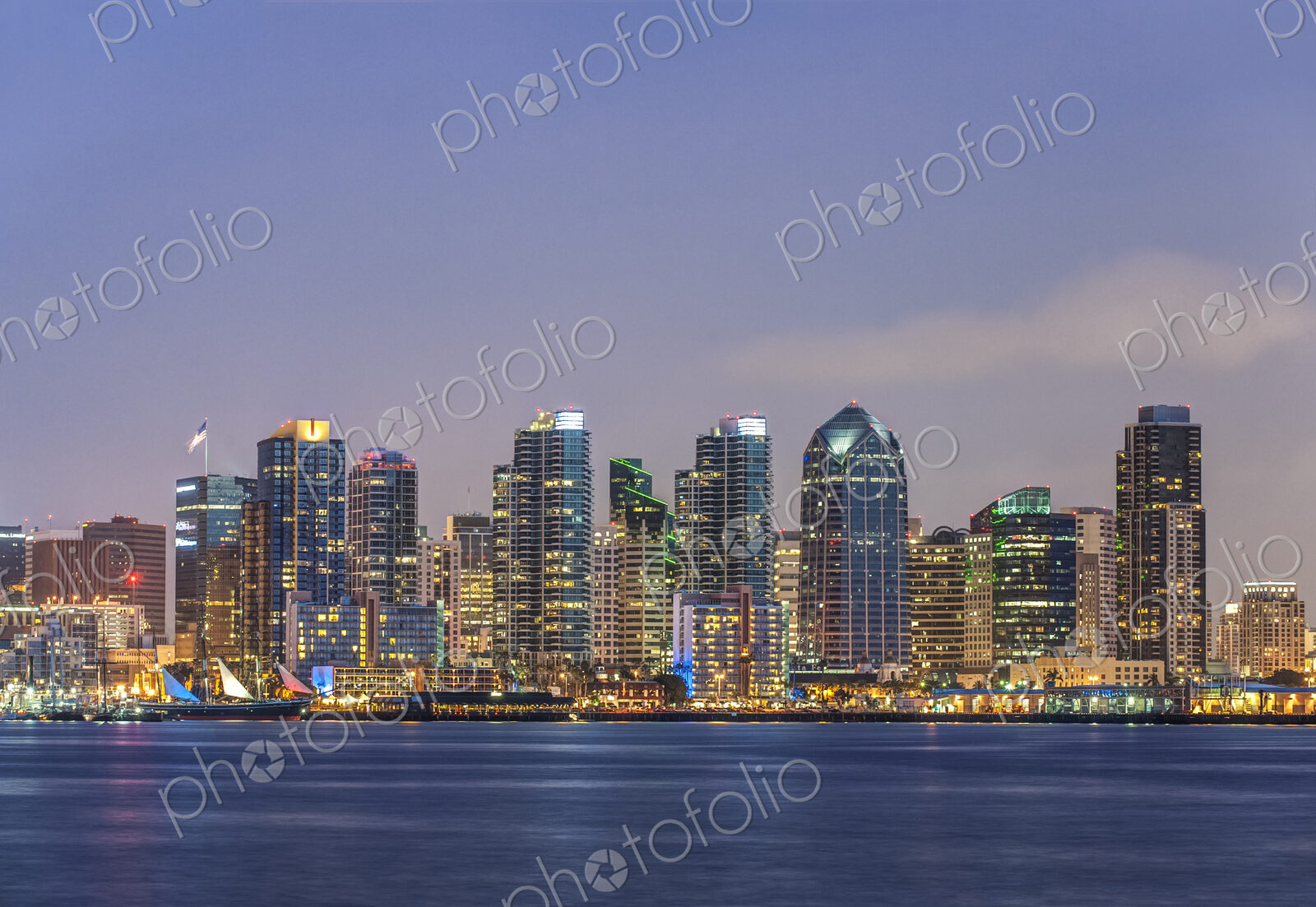 City skyline lit up at night, San Diego, California, United States