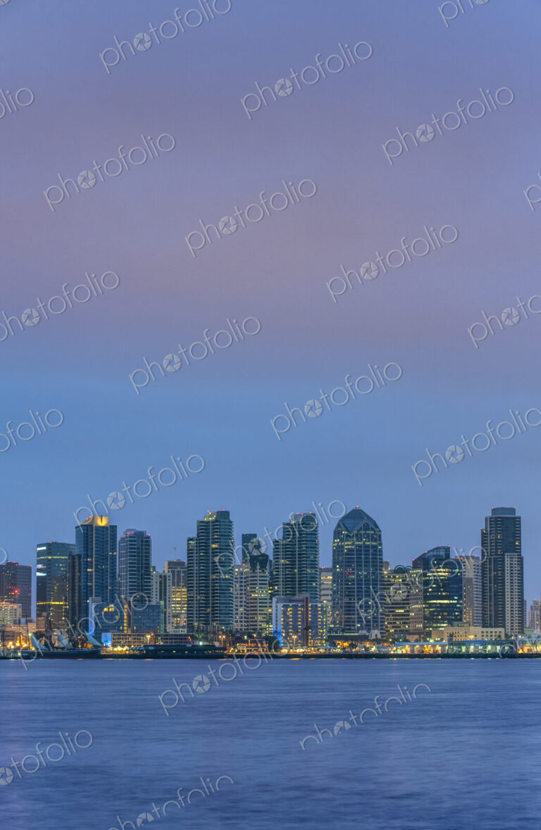 City skyline lit up at night, San Diego, California, United States