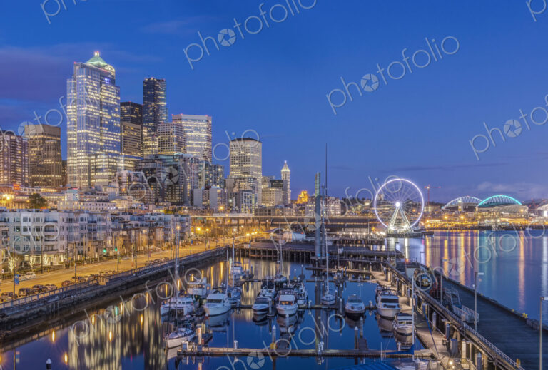City skyline lit up at night, Seattle, Washington, United States