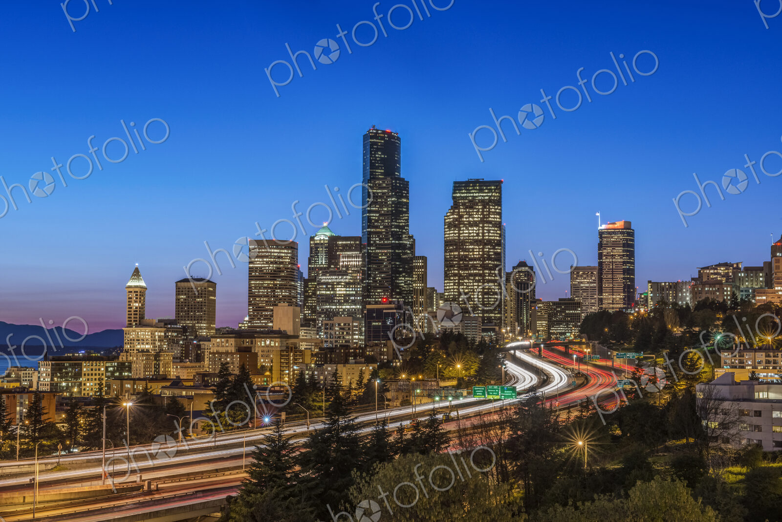 City skyline lit up at night, Seattle, Washington, United States