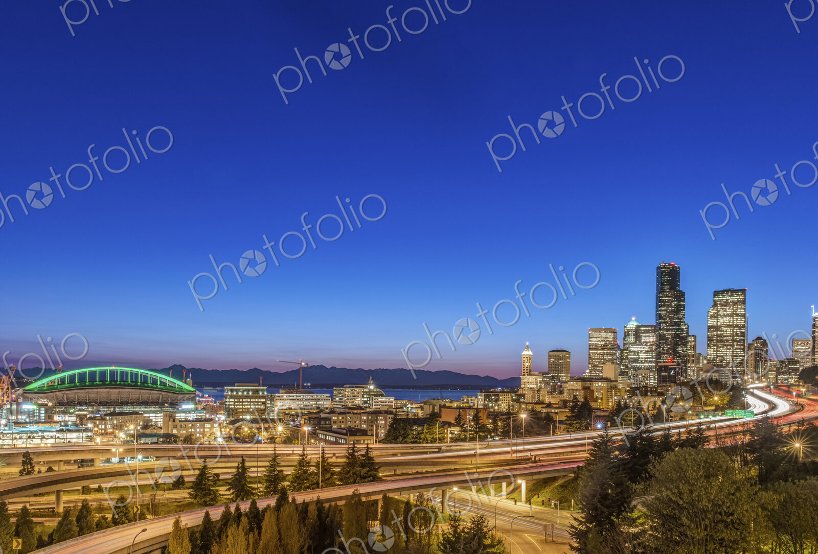 City skyline lit up at night, Seattle, Washington, United States