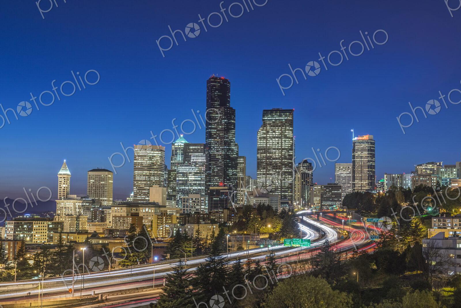 City skyline lit up at night, Seattle, Washington, United States