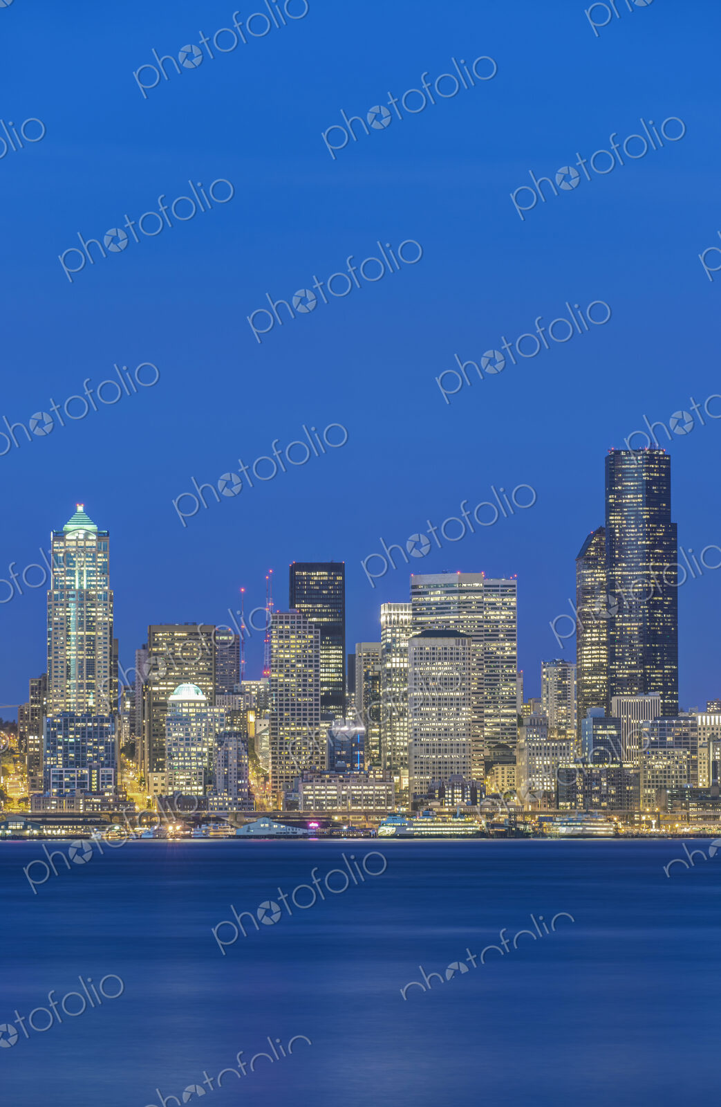 City skyline lit up at night, Seattle, Washington, United States
