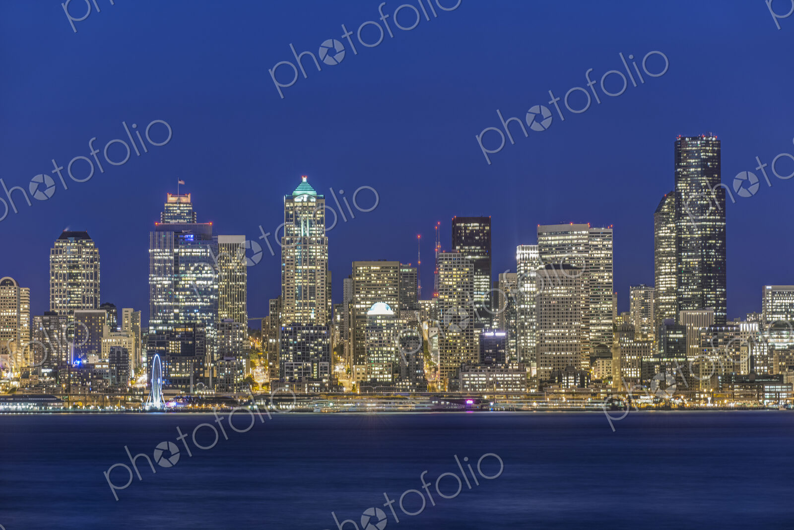 City skyline lit up at night, Seattle, Washington, United States