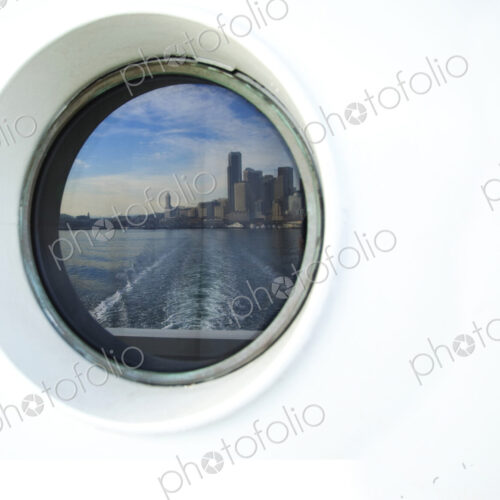 City skyline reflected in ferry porthole, Seattle, Washington, United States City skyline reflected in ferry porthole, Seattle, Washington, United States