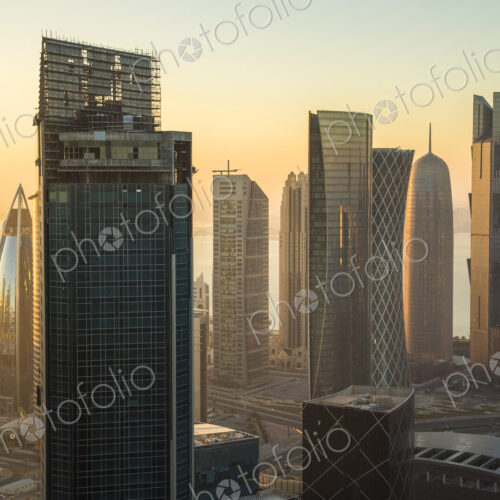 Cityscape with tall modern skyscrapers at dusk. Cityscape with tall modern skyscrapers at dusk.