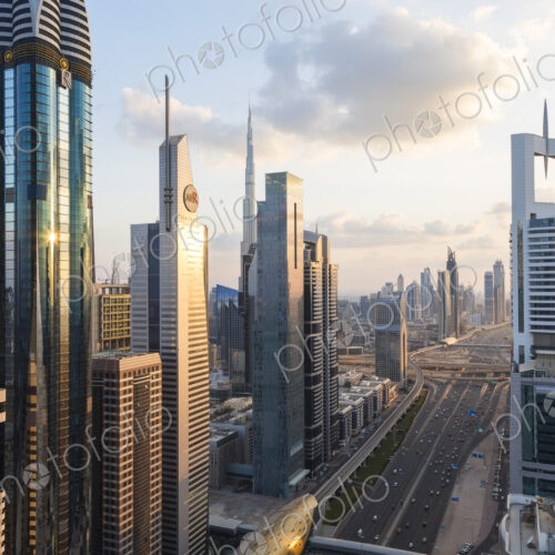 Cityscape with tall modern skyscrapers under a cloudy sky. Cityscape with tall modern skyscrapers under a cloudy sky.