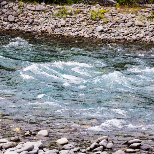 Clear flowing water of a river running over gravel. Clear flowing water of a river running over gravel.