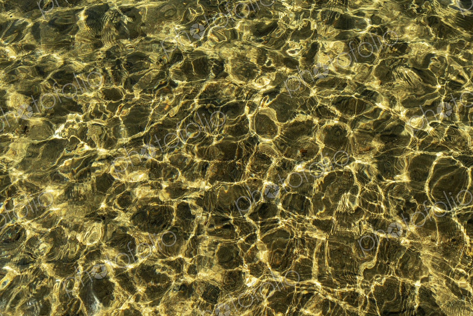 Clear lake water, patterns on the surface and reflections at Lake Tahoe.